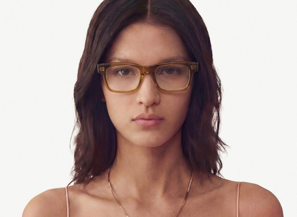 Front view of a pair of eyeglasses called the Expert in Olive