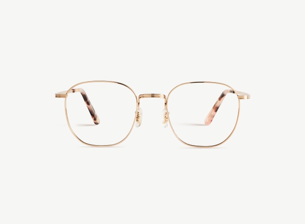 Front view of a pair of eyeglasses called the Trendsetter in Rose Gold