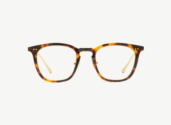 Front view of a pair of eyeglasses called the Trader in Tortoise
