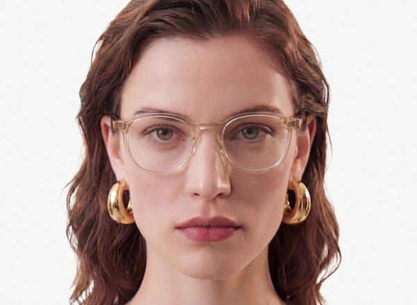 Front view of a pair of eyeglasses called the Idealist in Tan