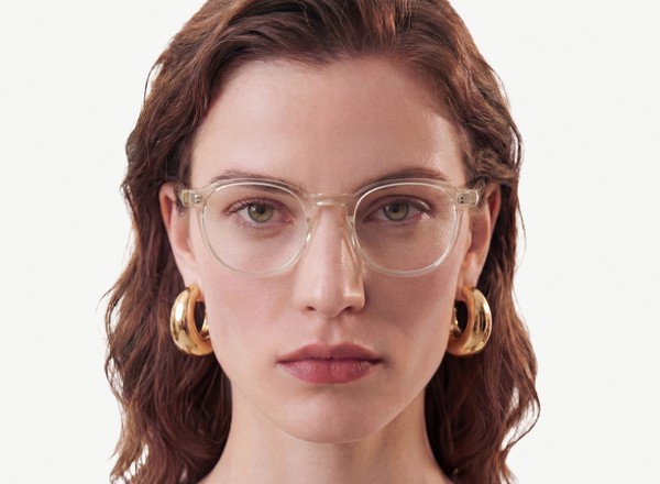 Front view of a pair of eyeglasses called the Idealist in Champagne