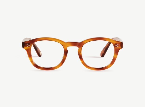 Front view of a pair of eyeglasses called the Optimist in Honey