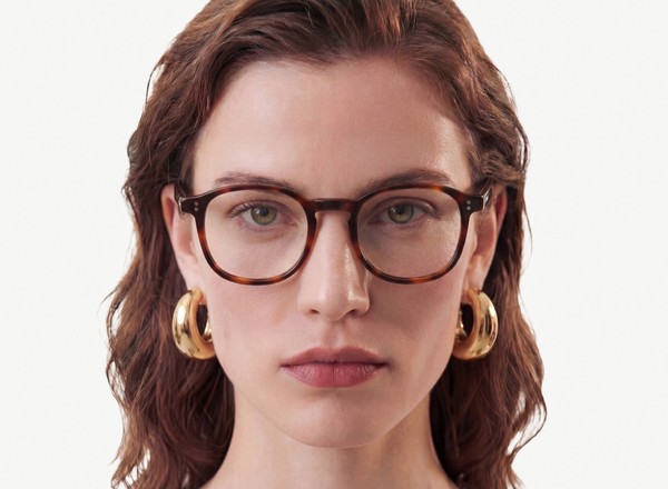 Front view of a pair of eyeglasses called the Idealist in Cognac