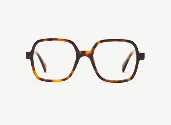 Front view of a pair of eyeglasses called the Reporter in Tortoise