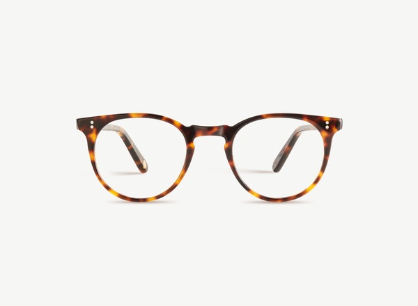 Front view of a pair of eyeglasses called the Parisian in Tortoise