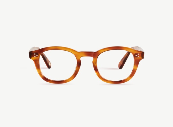 Front view of a pair of eyeglasses called the Optimist in Honey