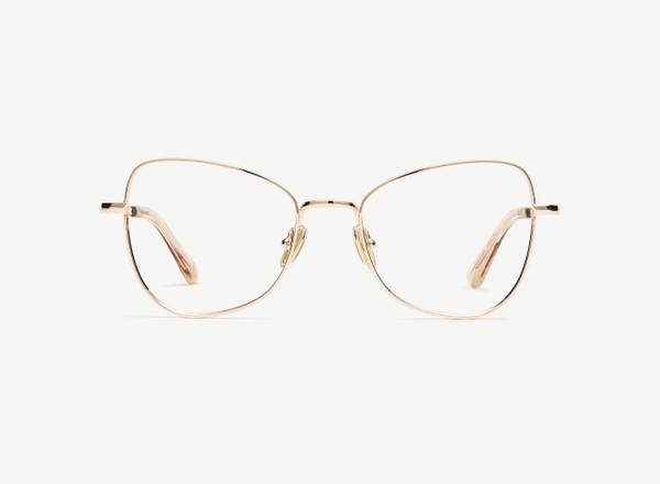 Front view of a pair of eyeglasses called the Muse in Gold