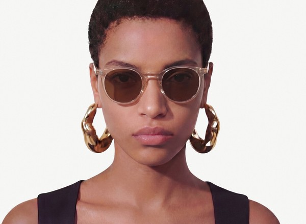 Front view of a pair of eyeglasses called the Traveller in Peach