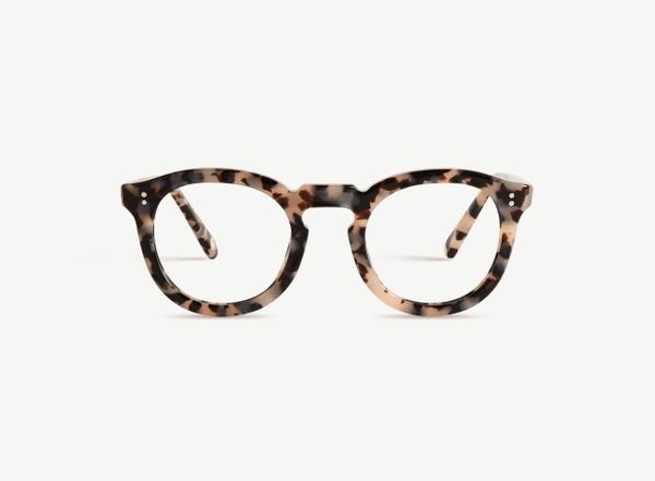 Front view of a pair of eyeglasses called the Charmer in Latte