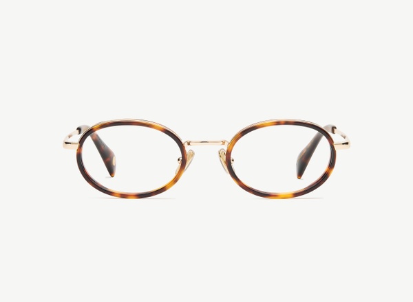 Front view of a pair of eyeglasses called the Vogue in Tortoise