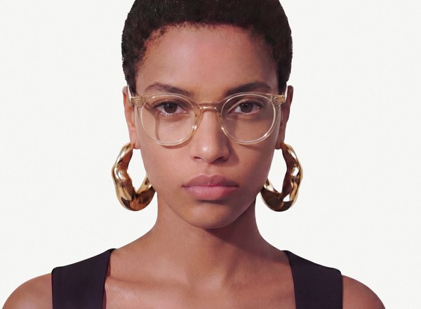 Front view of a pair of eyeglasses called the Traveller in Peach