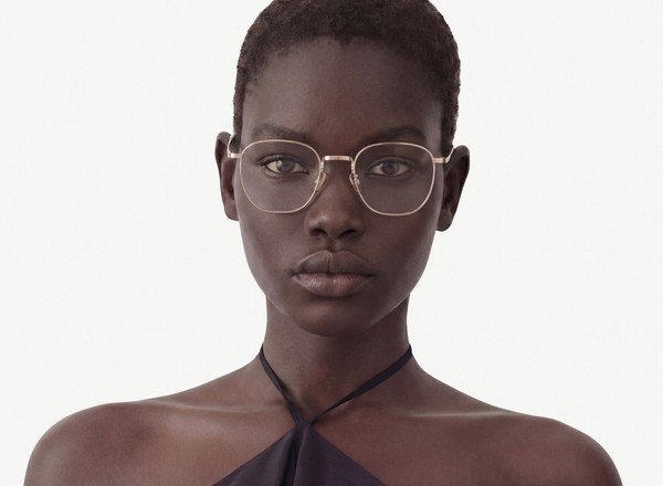Front view of a pair of eyeglasses called the Trendsetter in Gold