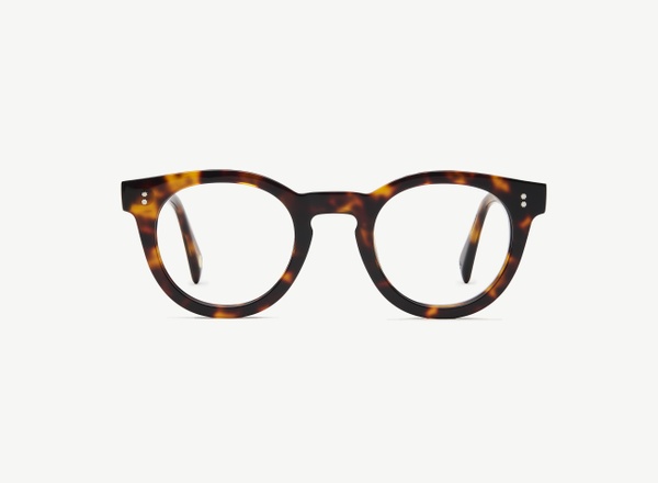 Front view of a pair of eyeglasses called the Messenger in Tortoise