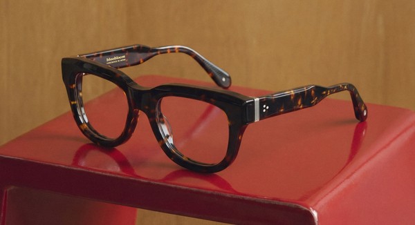 Tortoiseshell optical glasses by Bloobloom displayed on red surface, handcrafted eyewear product shot