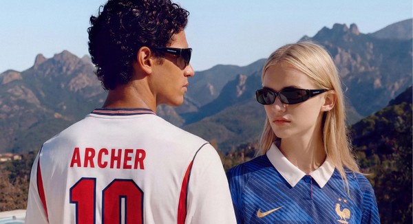 Two models wearing ARCHER sunglasses by a pool with mountain views.